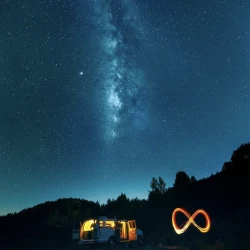 Milky way galaxy above a van with light painting