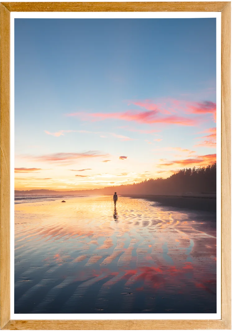 Framed picture of a girl walking on the beach of Tofino at sunset